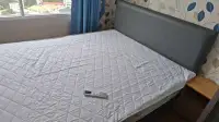 1 Bedroom Condo for Rent at Lumpini Ville Naklua-Wongamat bedroom with double bed and city-view window