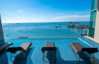 Marina Bayfront Sriracha infinity pool lounge area overlooking the sea