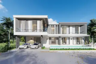 Luxury Vista Villas street view of modern villas with palm trees and lush green landscaping.