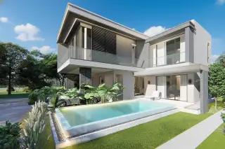 Luxury Vista Villas front view of a modern villa with a two-car garage and tropical plants.
