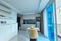 1 Bedroom Condo for Sale & Rent at Serenity Wongamat with kitchen, dining area, and balcony access.