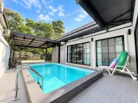 3 Bedroom House for Sale in Mabprachan poolside terrace with sun loungers and glass sliding doors
