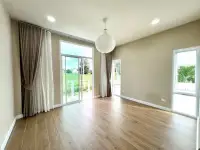 4 Bedroom House for Sale in Mabprachan spacious room with sliding glass doors overlooking green landscape