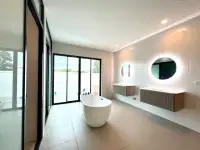 4 Bedroom House for Sale in Mabprachan master bathroom with freestanding tub and dual round mirrors