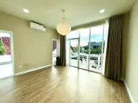 4 Bedroom House for Sale in Mabprachan empty bedroom with wood floors, balcony view and paper lantern light
