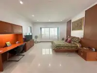 5 Bedroom House for Sale & Rent in Mabprachan spacious master bedroom with wooden desk, TV and balcony access
