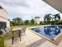 5 Bedroom House for Sale & Rent in Mabprachan poolside patio with outdoor dining table and garden view