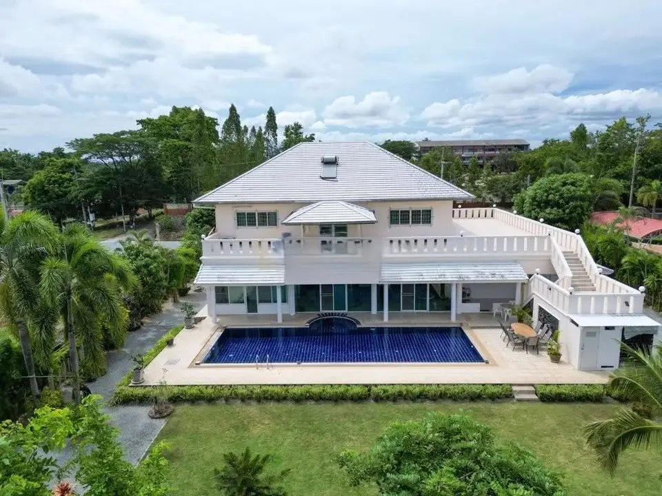 5 Bedroom House for Sale & Rent in Mabprachan aerial view of two-story villa with private pool and tropical garden