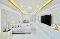 5 Bedroom House for Sale in Mabprachan master bedroom with marble feature walls, large bed, and wall-mounted TV