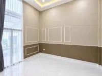 2 Bedroom House for Sale in Mabprachan empty room with wall molding, large window, and sheer curtains