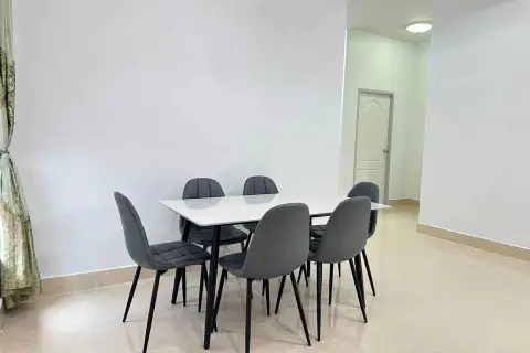 3 Bedroom House for Rent in Mabprachan dining area with white table and six gray upholstered chairs