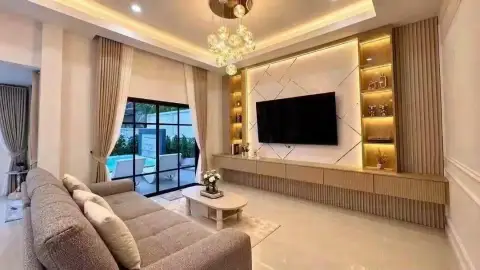 3 Bedroom House for Sale in Mabprachan living room with grey sofa and backlit marble TV wall