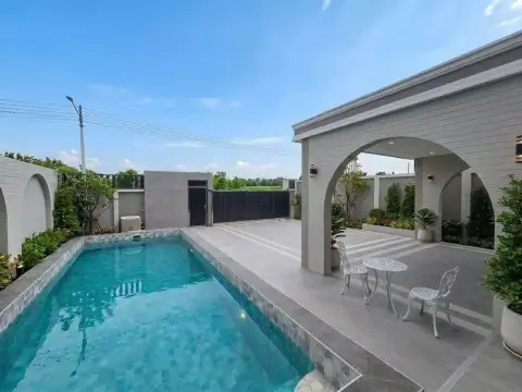 3 Bedroom House for Sale in Mabprachan poolside terrace with seating area and tiled deck