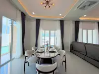 3 Bedroom House for Sale in Mabprachan dining area with round marble table and pool view