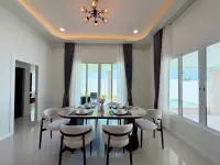 3 Bedroom House for Sale in Mabprachan elegant dining room with chandelier and garden view