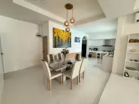 3 Bedroom House for Sale in Mabprachan open-plan dining area with kitchen view and wall art