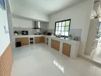3 Bedroom House for Sale in Mabprachan modern kitchen with wooden cabinets and marble counters