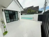 3 Bedroom House for Sale in Mabprachan poolside patio with black-framed glass doors