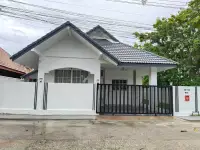 3 Bedroom House for Sale in Mabprachan exterior view of white house with black gate and tiled roof