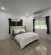 3 Bedroom House for Sale in Mabprachan bedroom with beige upholstered headboard and dark curtains