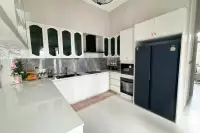 4 Bedroom House for Sale in Mabprachan modern kitchen with marble backsplash, built-in oven and fridge freezer