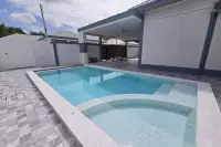 4 Bedroom House for Rent in Mabprachan with private pool, jacuzzi, and covered patio seating area