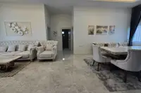 4 Bedroom House for Rent in Mabprachan interior view of living room and dining area with marble flooring