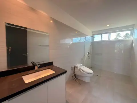 5 Bedroom House for Rent in Mabprachan modern bathroom with glass walk-in shower and dark stone vanity