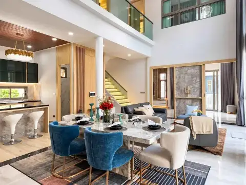 5 Bedroom House for Rent in Mabprachan open-concept living and dining space with staircase and mezzanine