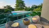 6 Bedroom House for Rent in Mabprachan rooftop terrace seating overlooking pool and lush greenery