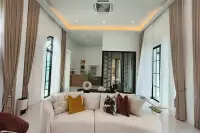 5 Bedroom House for Sale in Mabprachan elegant living area with chandelier and wall-mounted TV
