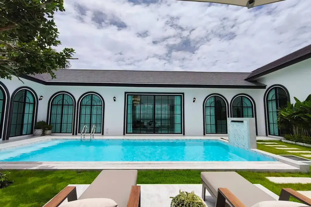 5 Bedroom House for Sale in Mabprachan open-plan living room with sectional sofa and dining area