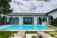 5 Bedroom House for Sale in Mabprachan open-plan living room with sectional sofa and dining area