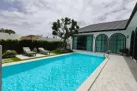 5 Bedroom House for Sale in Mabprachan curved sofa lounge with sheer curtains and natural light