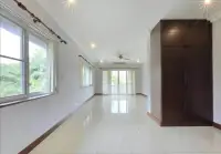 5 Bedroom House for Sale in Mabprachan hallway with built-in wooden wardrobe and large windows