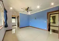 5 Bedroom House for Sale in Mabprachan empty room with blue walls and dark wood door frames