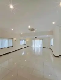 5 Bedroom House for Sale in Mabprachan spacious living area with glossy tile floor and curtained windows