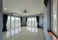 5 Bedroom House for Sale in Mabprachan upstairs room with glossy tile floor and sliding glass doors to balcony