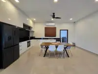 3 Bedroom House for Sale in Mabprachan modern kitchen with wooden dining table and black cabinetry