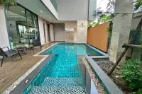 4 Bedroom House for Sale & Rent at Madcha Nirvana private pool with wooden deck and outdoor seating area