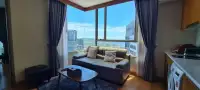 1 Bedroom Condo for Rent at Marina Bayfront Sriracha corner window seating area with ocean skyline view
