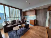 1 Bedroom Condo for Rent at Marina Bayfront Sriracha open-plan kitchen with washing machine and sofa