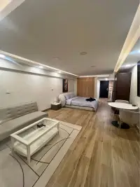 1 Bedroom Condo for Sale at Metro Jomtien Condotel open-plan studio layout with bed, sofa, and dining area
