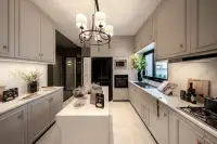 4 Bedroom House for Sale at Chieftain classic kitchen with marble island, grey shaker cabinets, chandelier, and built-in oven