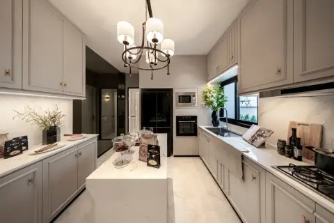4 Bedroom House for Sale at Chieftain elegant kitchen with marble island, grey cabinetry, chandelier and built-in appliances