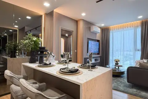2 Bedroom Condo for Sale at Aquarous Jomtien Pattaya en-suite bathroom with soaking bathtub and dark marble-tiled walls