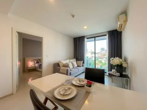 1 Bedroom Condo for Sale at Acqua Condo dining area with city view balcony and bedroom entrance