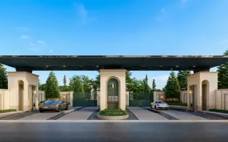 The Palm Grandio's grand entrance gate with a central guardhouse, two luxury cars, and lush green landscaping.