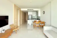 1 Bedroom Condo for Rent at Movenpick Residences open-plan living area with dining table and modern kitchen.