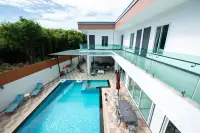 8 Bedroom House for Rent in Na Kluea aerial daytime view of pool, patio and dining area